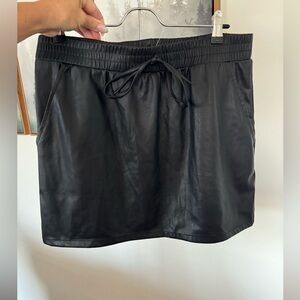 New with tags black faux leather skirt with pockets size Large